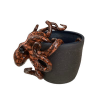 Rust Octopus on Black Cup
