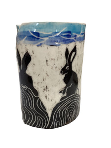 Rabbits on Rock Canister