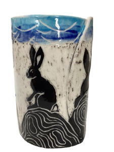 Rabbits on Rock Canister